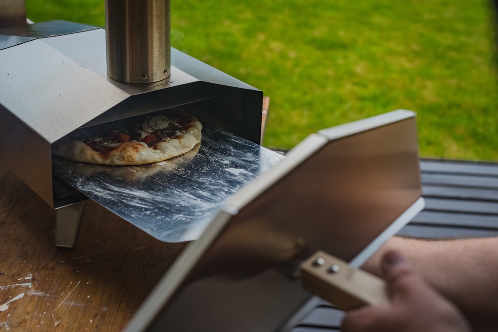 adjusting pizza in oven