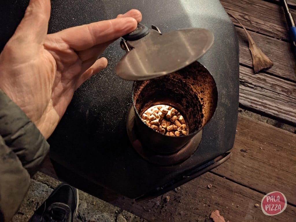 Filling the Ooni Fyra pizza oven with wood pellets