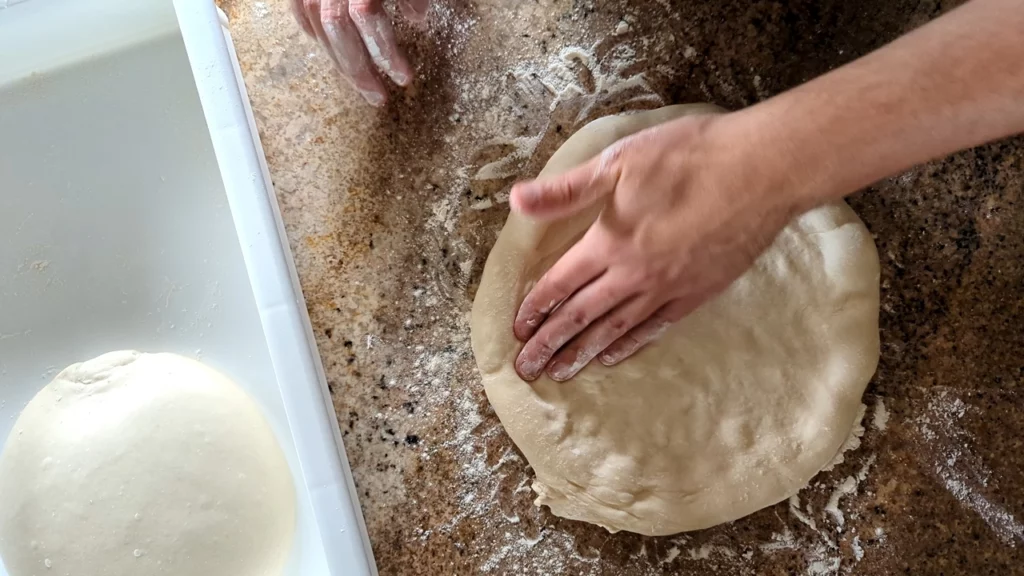 stretching dough mexican pizza 1024x576 jpg