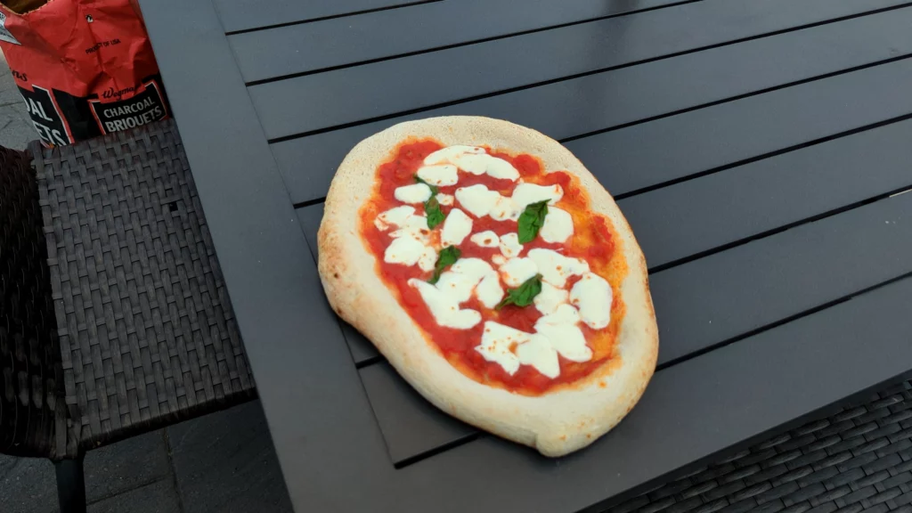 First cook on the Walmart 15” Expert grill charcoal pizza oven. I still  need some practice, but pretty great for the first try! : r/pizzaoven