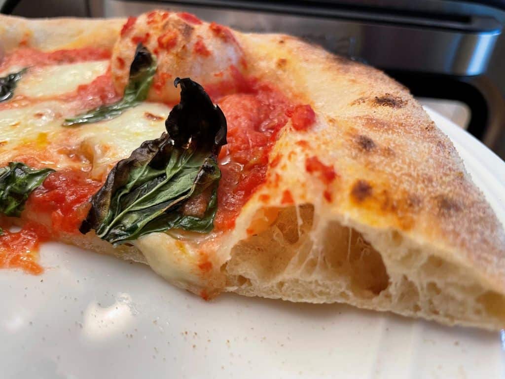 Close up picture of the margherita pizza showing the interior crumb.