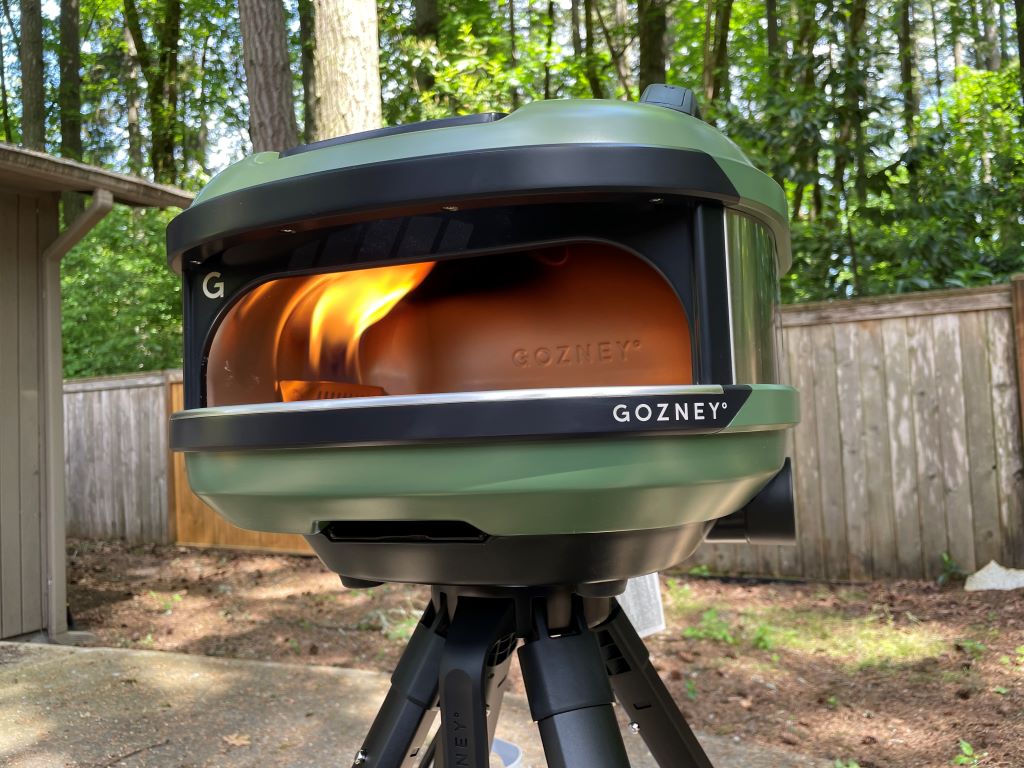 The Tread pizza oven sits on its stand with the burner running.