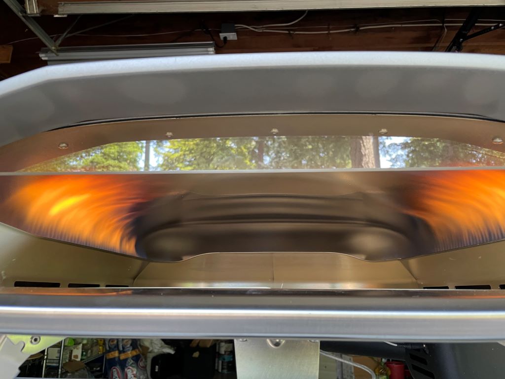 The dual-side burners of the Koda 2 Pro lick up the sides of the oven's interior.