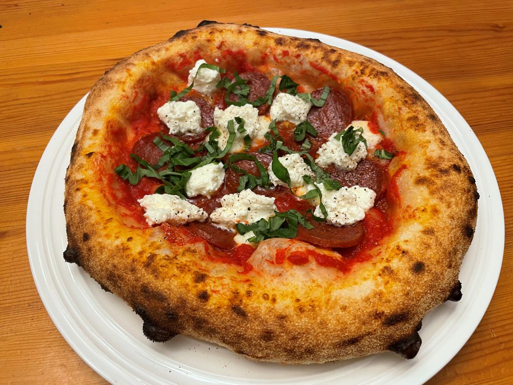 Pizza Party Ispirazione - A True Neapolitan Experience From the Birthplace of Pizza Pizza Oven Neapolitan pizza with chorizo, basil, and fresh ricotta.