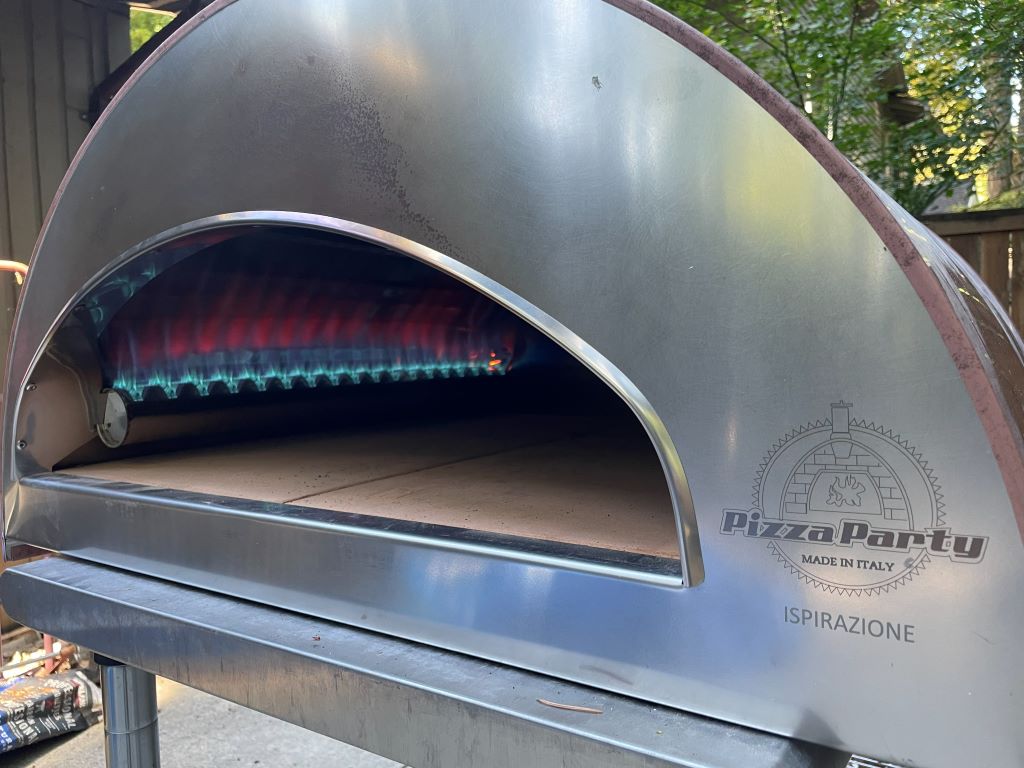 Pizza Party Ispirazione - A True Neapolitan Experience From the Birthplace of Pizza Pizza Oven The powerful propane burner is lit inside the Inspirazione oven.