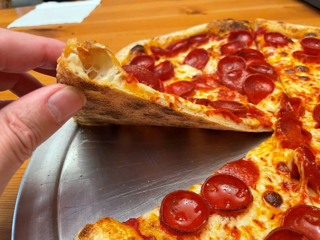 Gozney Dome Gen 2 Review - Gozney's Biggest Oven Gets Even Bigger Pizza Oven Pepperoni pizza cooked in the Gozney Dome Gen 2, showing a well cooked undercarriage